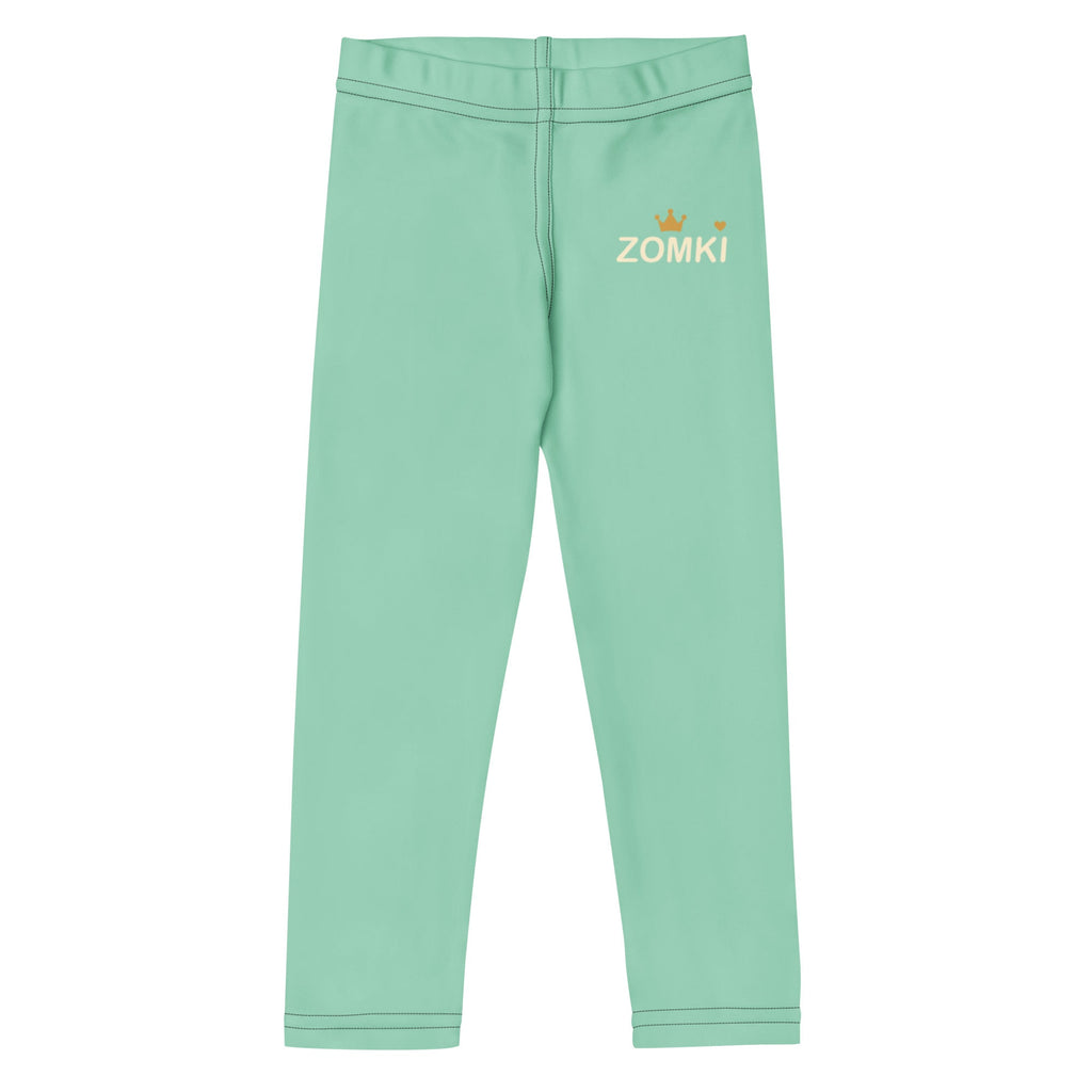 Maqueta del proveedor: leggings infantiles menta Printful 5301K con logotipo ZOMKI en crema y dorado.
