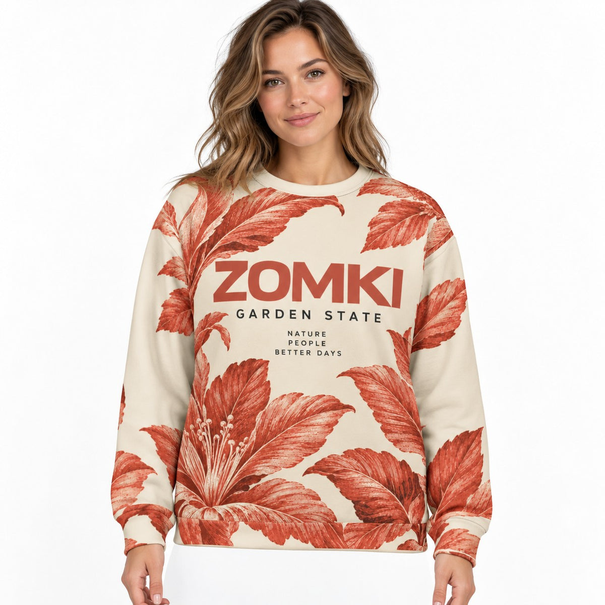 Sudadera ZOMKI Garden State · Crema y terracota en modelo adulto; se vende solo la sudadera. Imagen generada con IA.