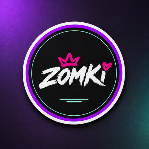 Imán magnético redondo ZOMKI Night Crown de 10 cm, solo, sobre fondo oscuro con luz violeta y menta. Logotipo blanco, corona y corazón rosa.